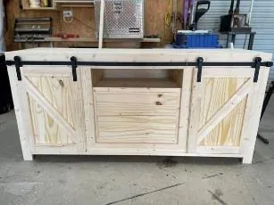 Handmade whitewashed media console with sliding barn doors